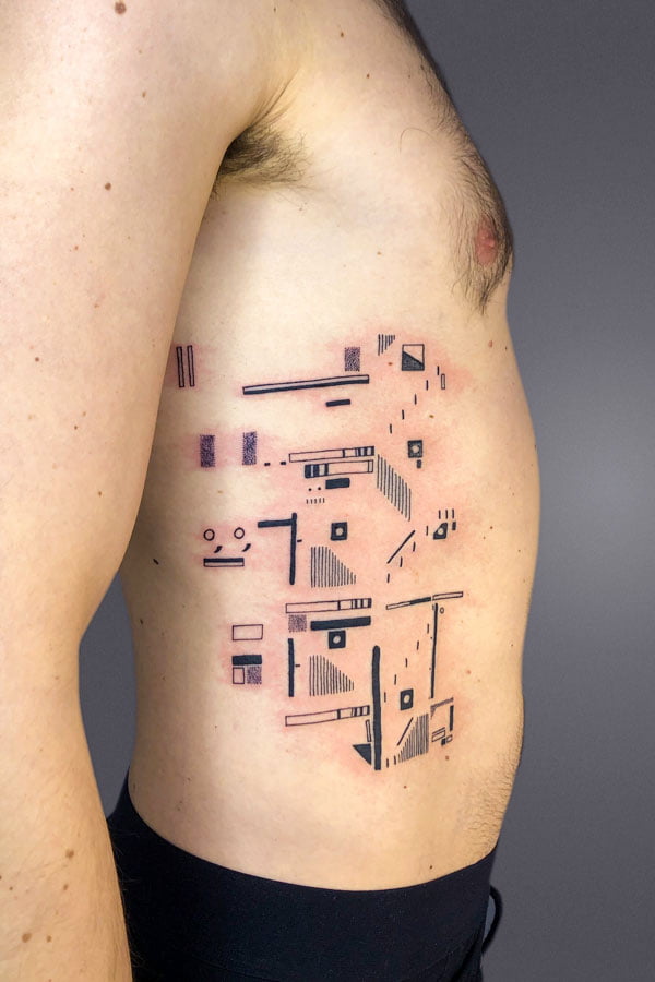 tattoo of staircase and graphic facade elements