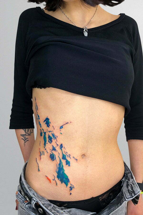 blue sea fauve belly tattoo