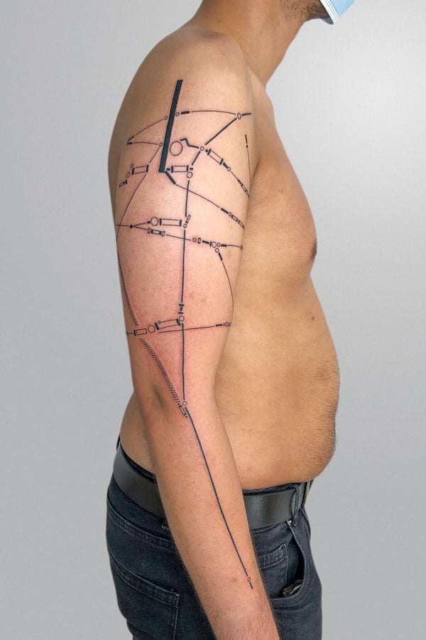 full arm tattoo inspired by tram power lines