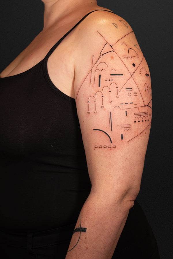fineline tattoo about tram lines and architecture in schaerbeek