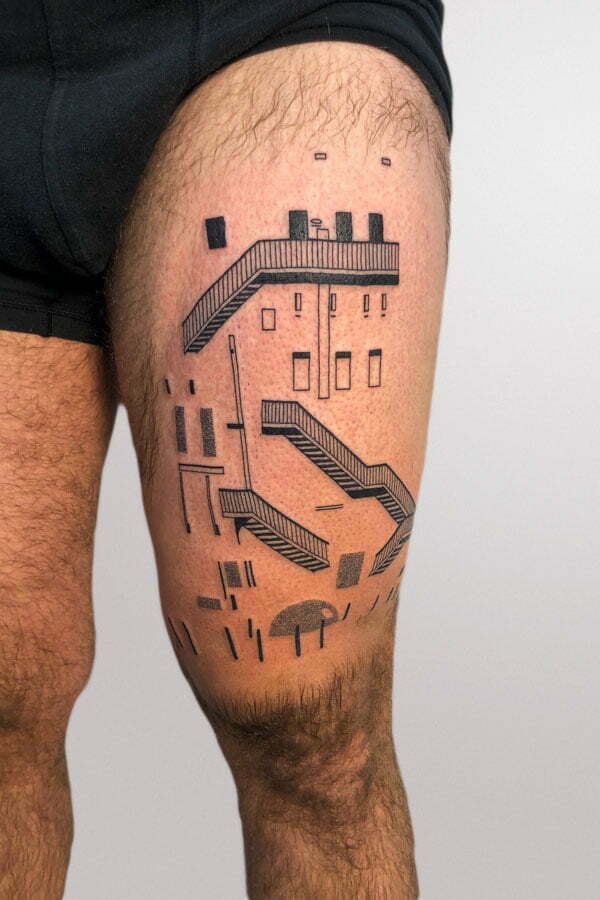 lisbon architecture and stairs tattooed on thigh