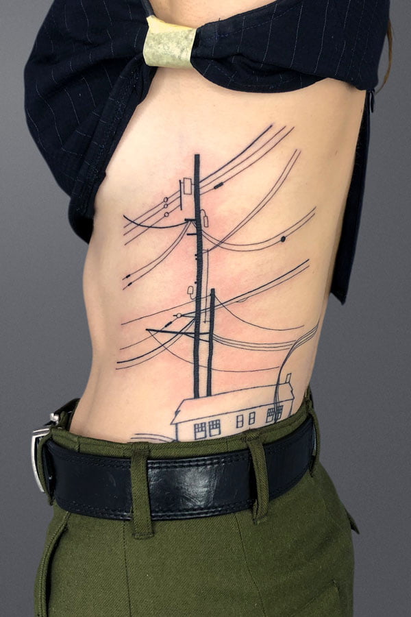 powerline pole and lines inked on ribs