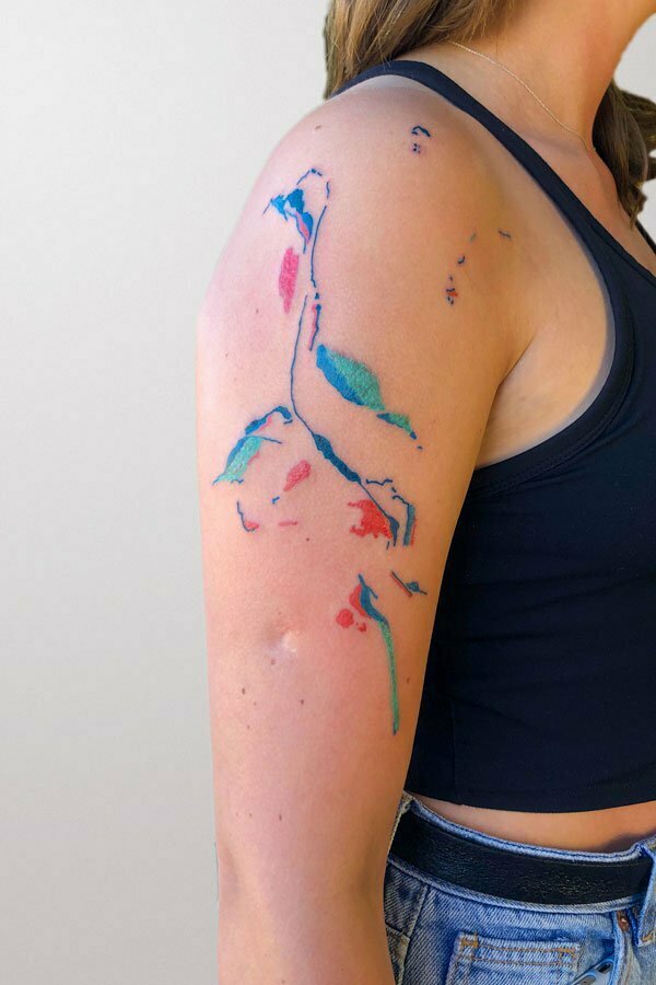 abstract colorful tattoo inspired by rocks and sea